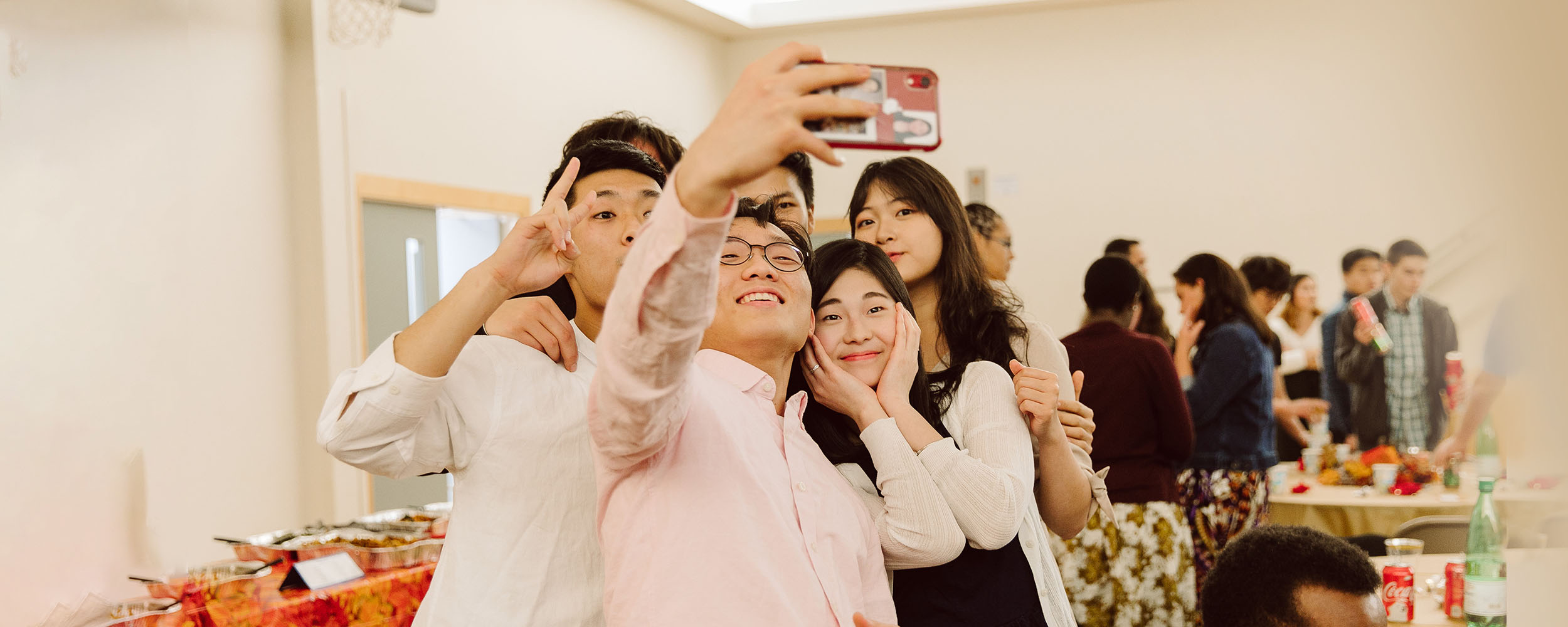 Friends taking group selfie together
