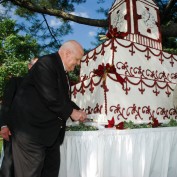 Ken Olsen cutting the cake at groundbreaking ceremony