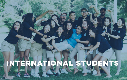 An image that says “International Students” with a group of students in the background.