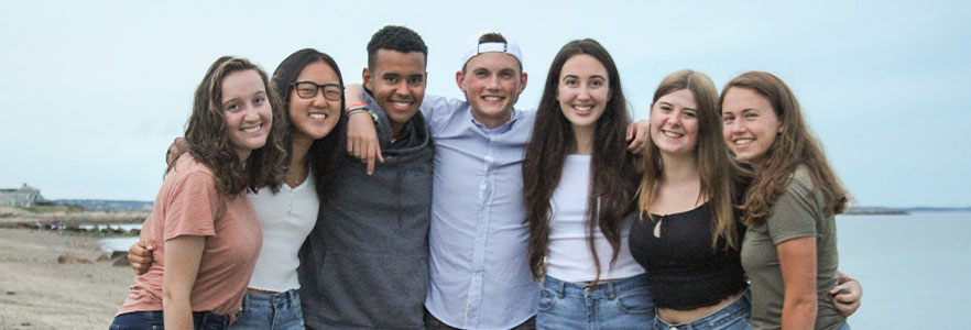 Group of seven honors students at beach