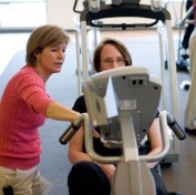 Marie Lucey, Clinical Manager, explaning some equipment to Gordon faculty member, Kaye Cook.