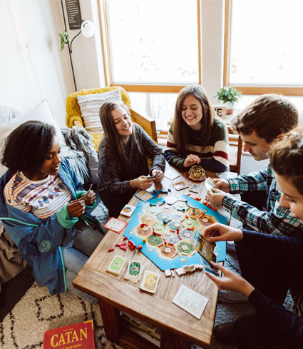 students playing boardgame